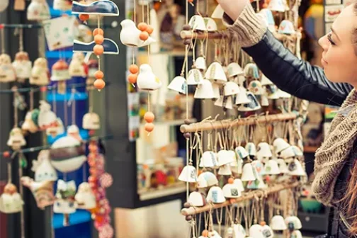 Woman buying souvenirs from a giftshop